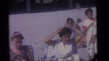 Camden New Jersey (1960): Woman Wearing White Shirt Brushes Hair On A Bright Sunny