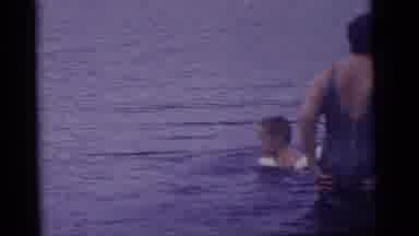 Camden New Jersey US (1960): Two Women Watching Two Children Enjoy Being In The