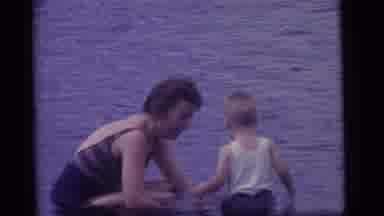 Camden New Jersey US (1960): A Mother Playing With Her Son In A Lake During The