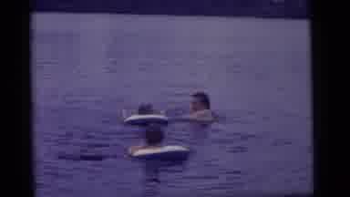 Camden New Jersey US (1960): Children Swim With Lifeguard In Mother Lake Float