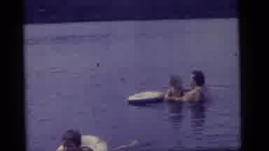 Camden New Jersey US (1960): A Woman Playing With A Child In A Lake While Another