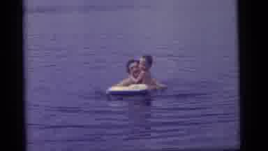 Camden New Jersey US (1960): Man And Kids Play With Inflatable Water Toys On A
