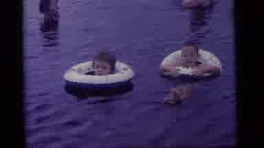 Camden New Jersey US (1960): Children Play By The Lake While People Bathe On A Hot