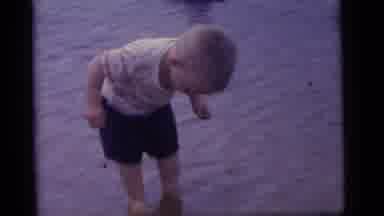 Camden New Jersey US (1960): A Young Boy And His Family Are In The Water Having A