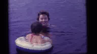 Camden New Jersey US (1960): Kids Play With Inflatable Water Toys In Lake In A