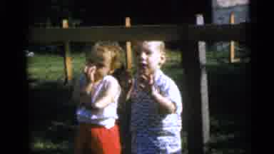 Camden New Jersey USA (1960): Two Toddlers Stand Behind A Ringed Fence Outside On