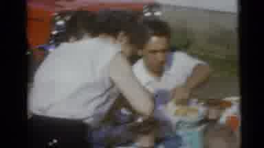 Camden New Jersey USA (1960): Family Sitting Down Outside On A Sunny Day For A