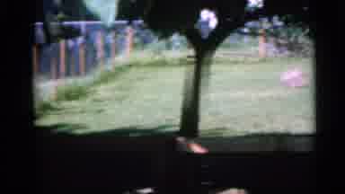 Camden New Jersey USA (1960): A Child Is Playing In The Garden With His Mother