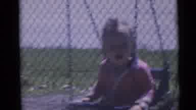 Camden New Jersey USA (1960): Children Happily Swing On Chair Swings In A Park