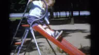 Camden New Jersey USA (1960): Little Boy Sliding Down A Steep Slide At A