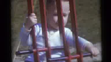 Camden New Jersey USA (1960): Little Boy In A White Shirt Playing Alone On A Red