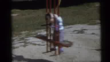 Camden New Jersey USA (1960): Boy Wearing Blue Shirt Plays On Backyard Swingset On