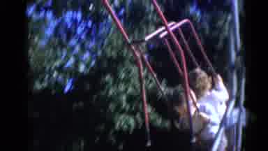 Camden New Jersey USA (1960): Two Children Playing On A Red Swing On A Playground