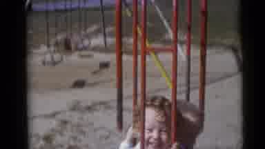 Camden New Jersey USA (1960): Two Children Playing On A Red Swing On A Sandy