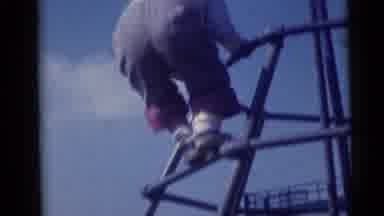 Camden New Jersey USA (1960): Multiple Children With Cuffed Pant Hems Climbing