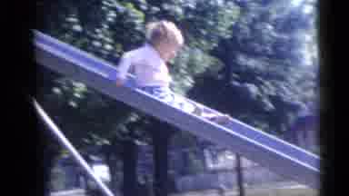Camden New Jersey USA (1960): Little Girl Goes Down Large Backyard Slide In Home