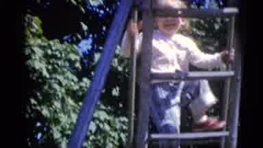 Camden New Jersey USA (1960): A Small Child Climbs Up And Slide And Then Slides