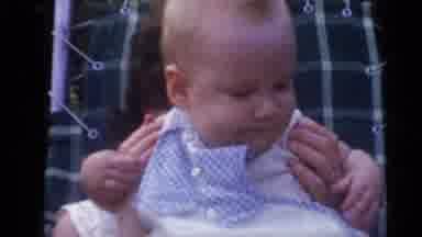 Camden New Jersey USA (1960): Woman With Small Baby On Lap Sits In Chair While Man