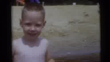 Camden New Jersey USA (1960): A Boy Is Playing In The Sea Shore His Whole Family