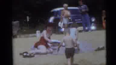 Camden New Jersey USA (1960): Woman And Children On Sand Cuts To Man Playing With