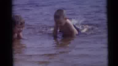 Camden New Jersey USA (1960): Kids Splash In Shallow Sea Water On A Clear Day