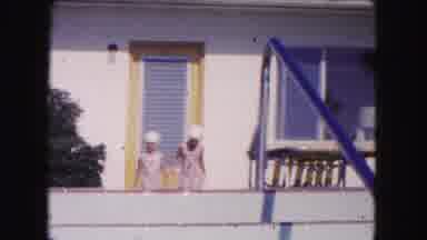 Miami Florida USA (1960): Two Girls In Swimsuits And Caps Walk Across A Porch