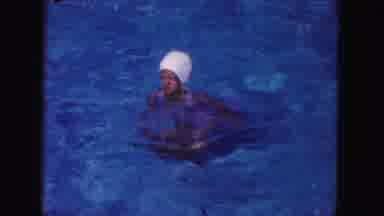 Miami Florida USA (1960): Girl With Pool Hat On Swimming Around And Then Goes
