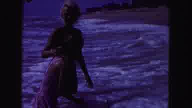 Miami Florida USA (1960): Woman And Girl Splashed By Sea Waves On A Sunny Day