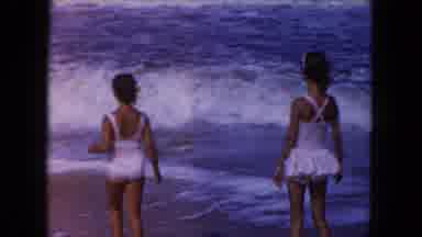 Miami Florida USA (1960): Girls By The Sea Fear Waves Mother Holds Hands To Care