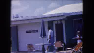 Miami Florida USA (1960): A Man And 2 Children Walking In Front Of A House During
