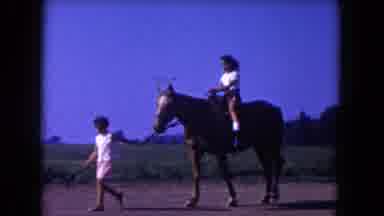 Miami Florida USA (1960): Girl Rides Horse While Another Child Leads The Horse