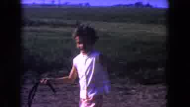 Miami Florida USA (1960): Child Appears To Be Holding Horse Reins While Watching