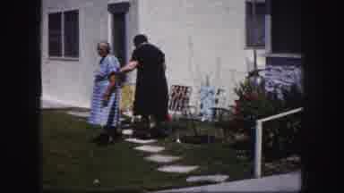 Tampa Florida USA (1960): Women Sit Outside The House And Position Themselves For