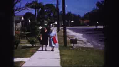 Tampa Florida USA (1960): Two Older Women Walking Together Down A Suburban