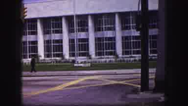 Tampa Florida USA (1960): A Silhouette Of A Person Walks Through An Urban Setting