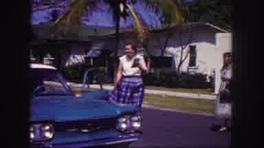 Tampa Florida USA (1960): A Vintage Blue Car Is Seen Followed By Driving Through A