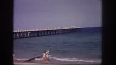 Tampa Florida USA (1960): People Take Romantic Walks On The Beach With The Ocean