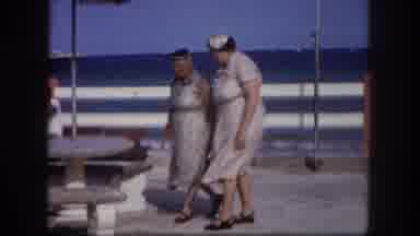 Tampa Florida USA (1960): Two Older Women Walking Across A Pier To A Picnic Table
