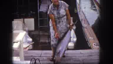 Tampa Florida USA (1960): Lady With A Big Fish In Her Hand On A Pear Behind Her A