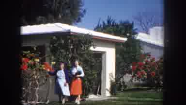 Tampa Florida USA (1960): Two Women Stand In Front Of White House With Red
