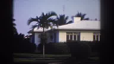 Tampa Florida USA (1960): A Slow Spanning Shot Of A Cream-Colored Home With Palm