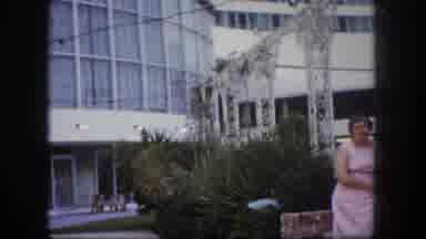 Tampa Florida USA (1960): Two Women Stand Beside White Modern Building On A Sunny