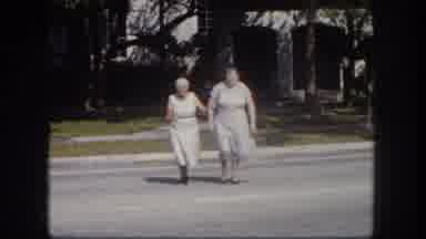 Tampa Florida USA (1960): Two Elderly Women Cross A Street Followed By Standing In