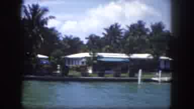 Tampa Florida USA (1960): Boat Near Waterway Homes And Dock On A Clear Day