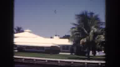 Tampa Florida USA (1960): Clip Of Passing Houses Alongside The Water By A Boat