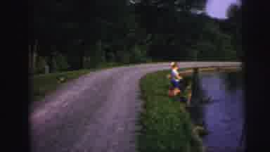 Lynbrook New York (1976): Kids Feeding Ducks Bread From The Bank Of A Large Pond