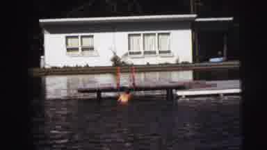 Lynbrook New York (1976): A Man In A Dark Bathing Suit Climbs Out Of Dark Lake And
