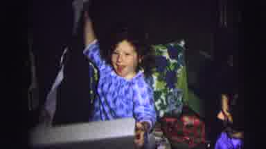 Lynbrook New York (1976): Child Opens Gift With Great Enthusiasm And Joy On