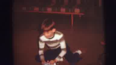 Lynbrook New York (1976): A Little Boy Smiling At The Camera Shyly As He Is Being