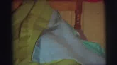 Lynbrook New York (1976): Child Hides Under A Green And Blue Blanket On Bed